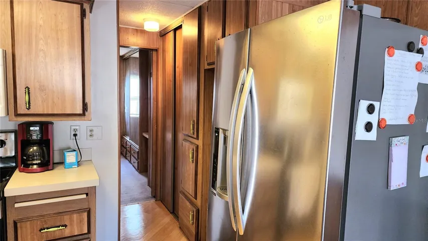 Kitchen and hallway to bed and bath