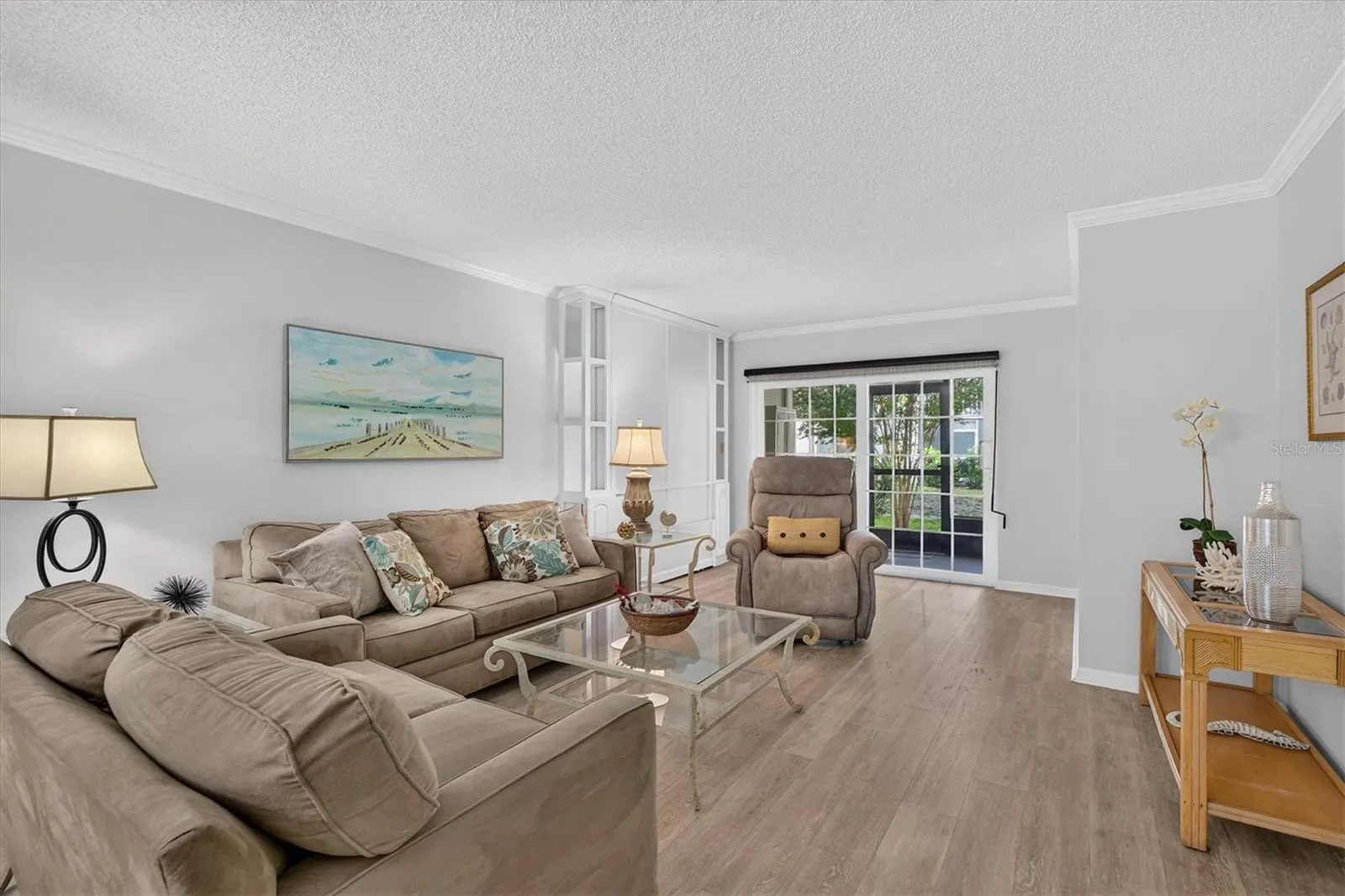 Fresh paint, crown molding and wood look flooring