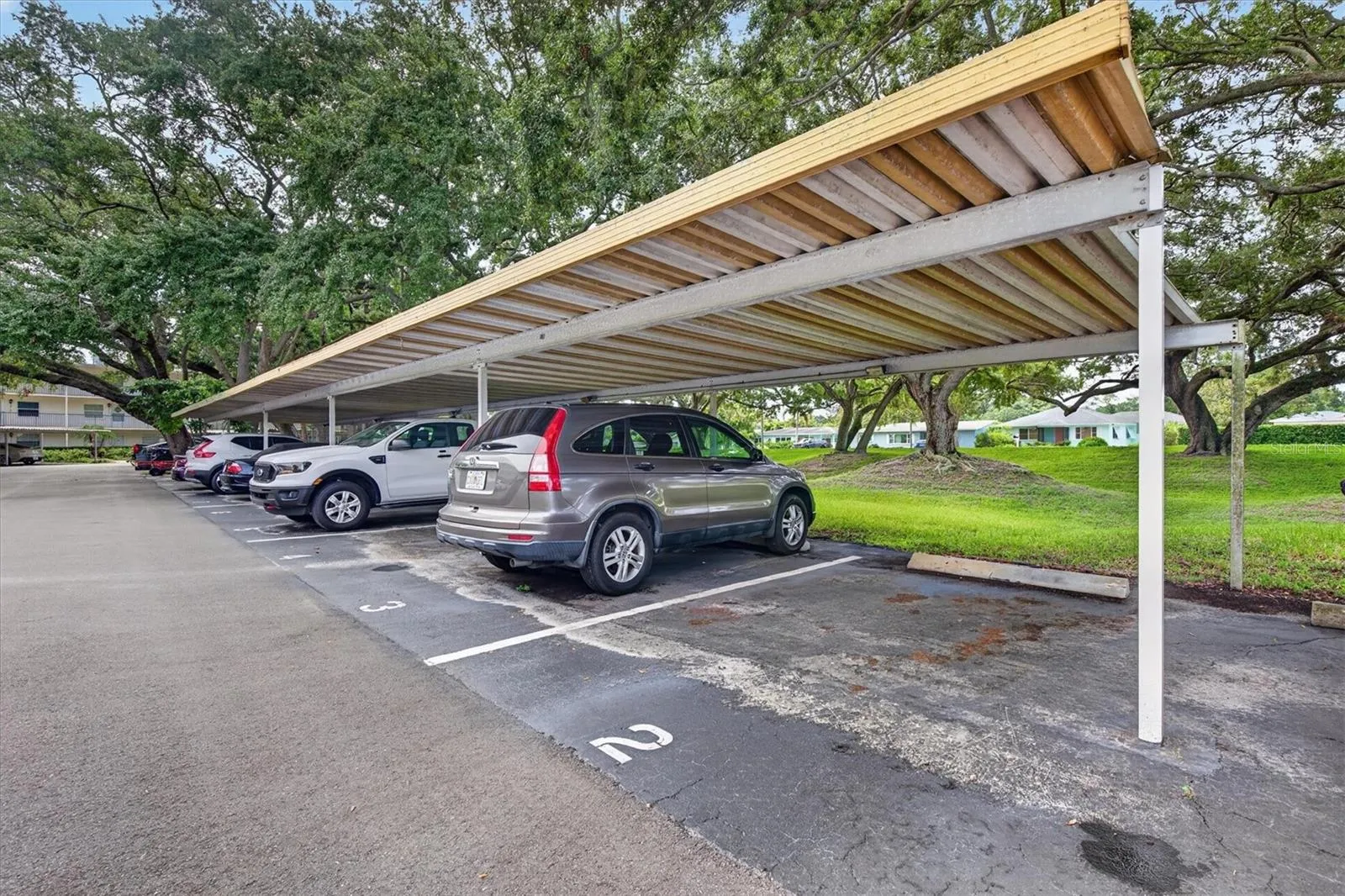 Deeded shaded carport & visitor parking