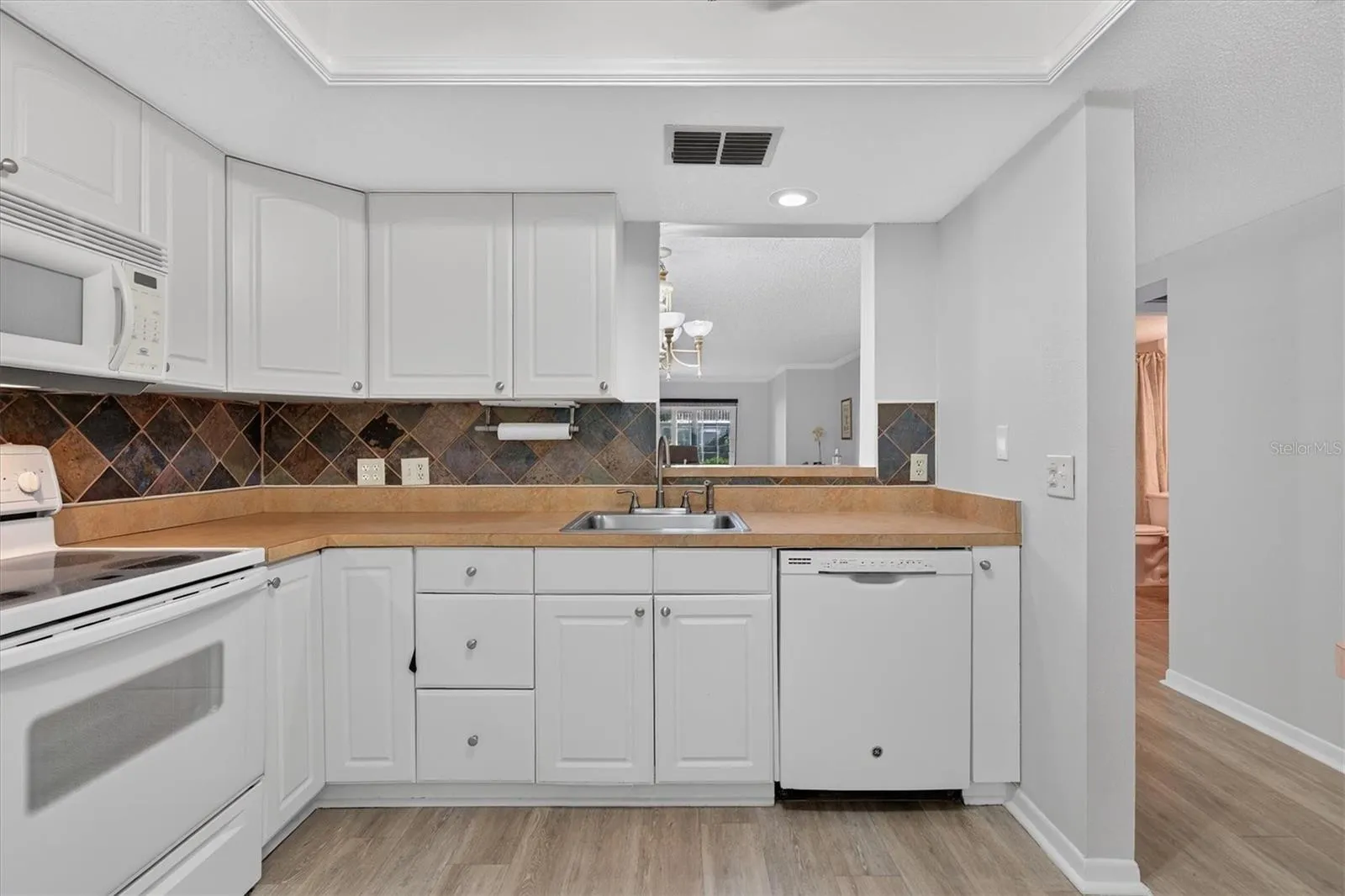 Kitchen opens to living area
