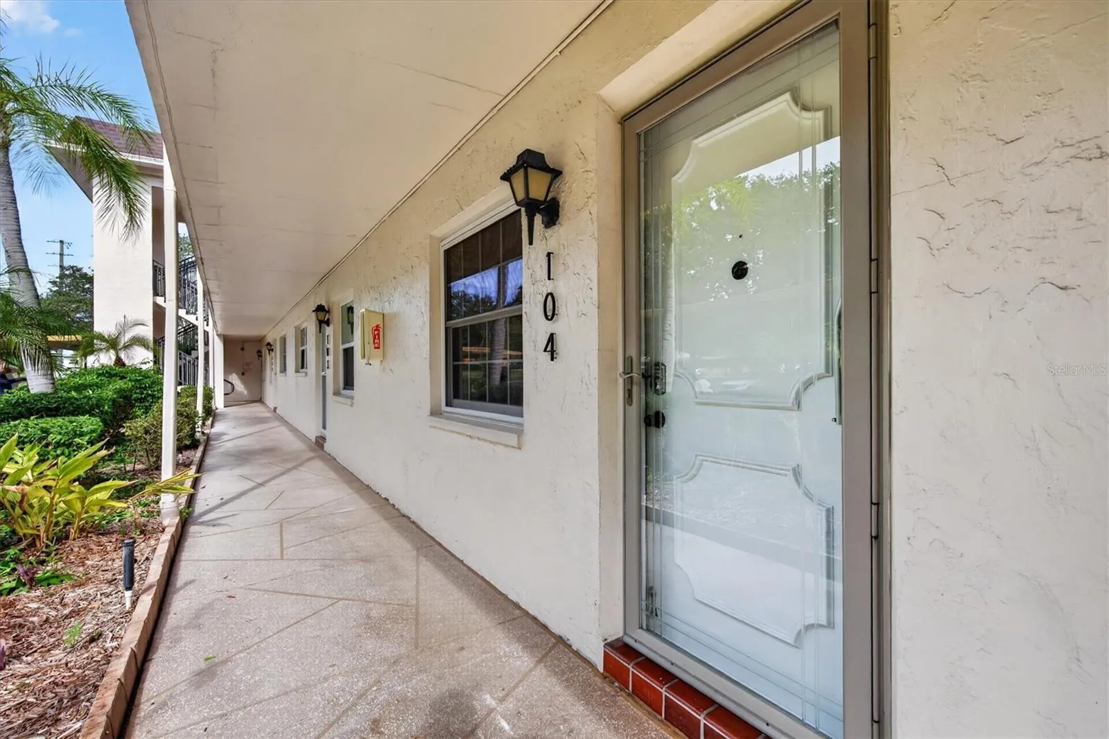covered breezeway and glass storm door