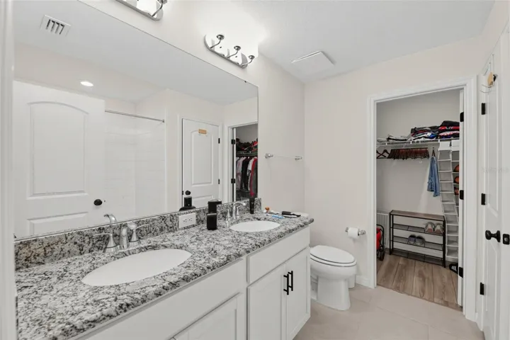 Primary Bathroom and walk-in closet