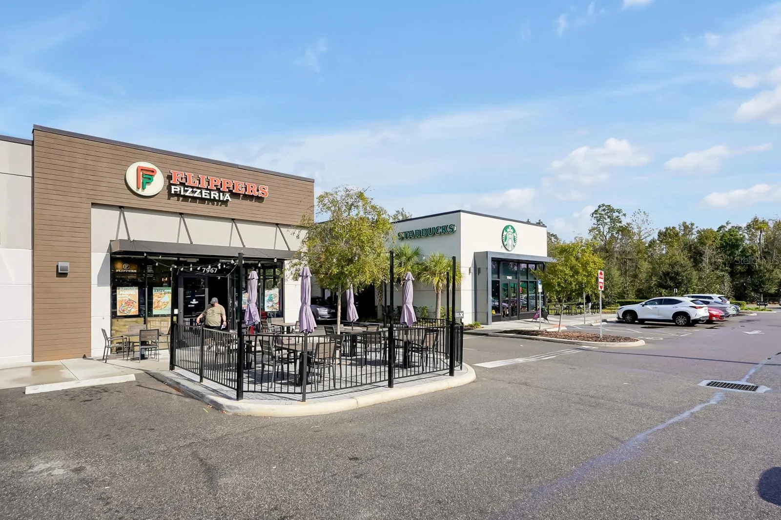 stores at entrance of community