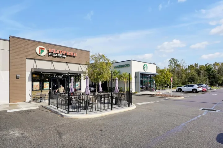 stores at entrance of community