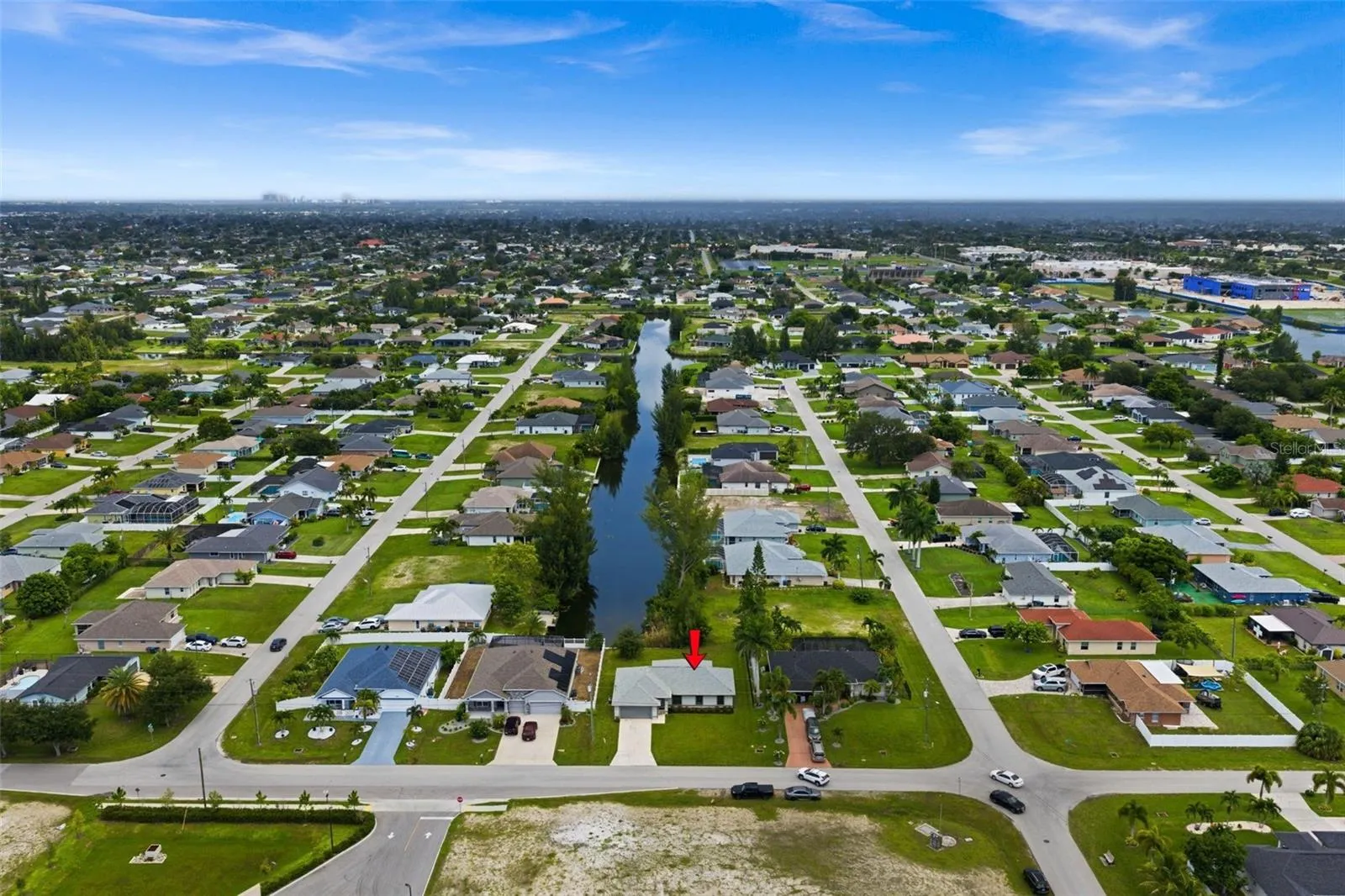 An aerial view of the house, canal and surrounding area