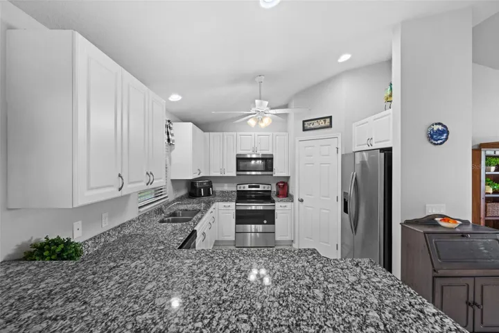 Granite counters in the spacious kitchen