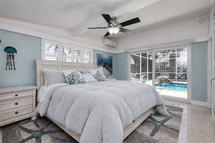 Primary bedroom with pool view