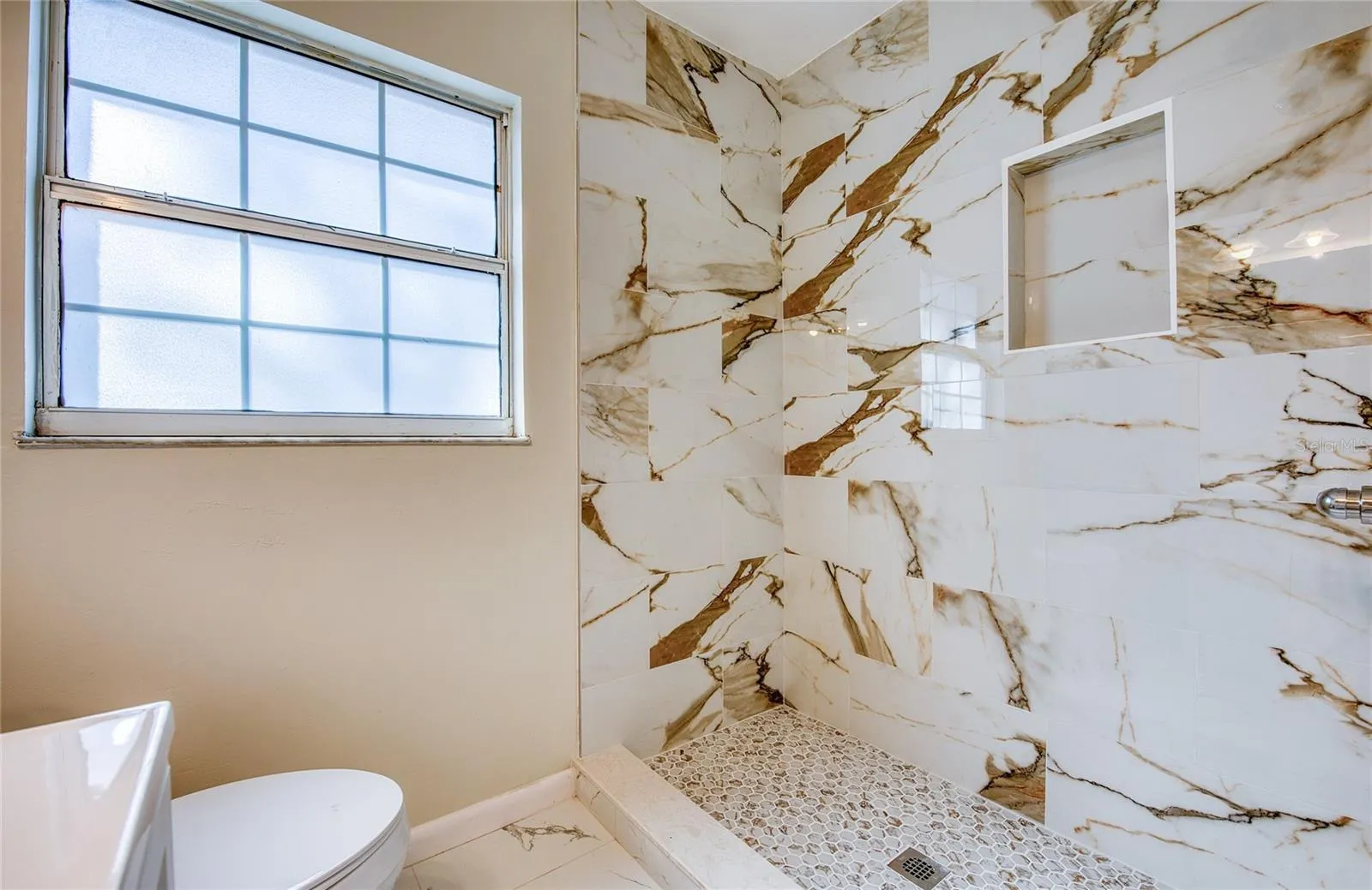 lovely  marble tiled shower