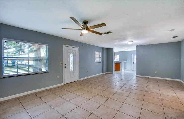 Large living dining room with lots of window that make it bright. new paint throughout.