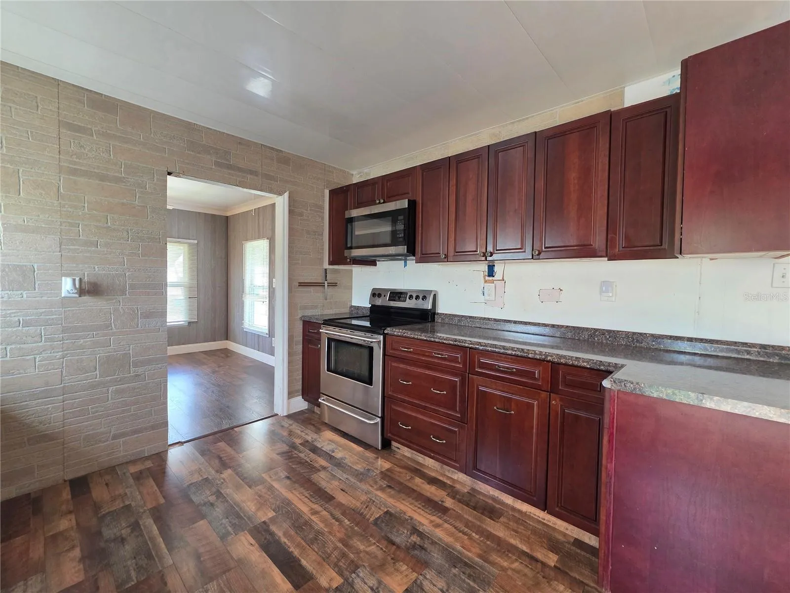 Kitchen with updated cabinetry and appliances.
