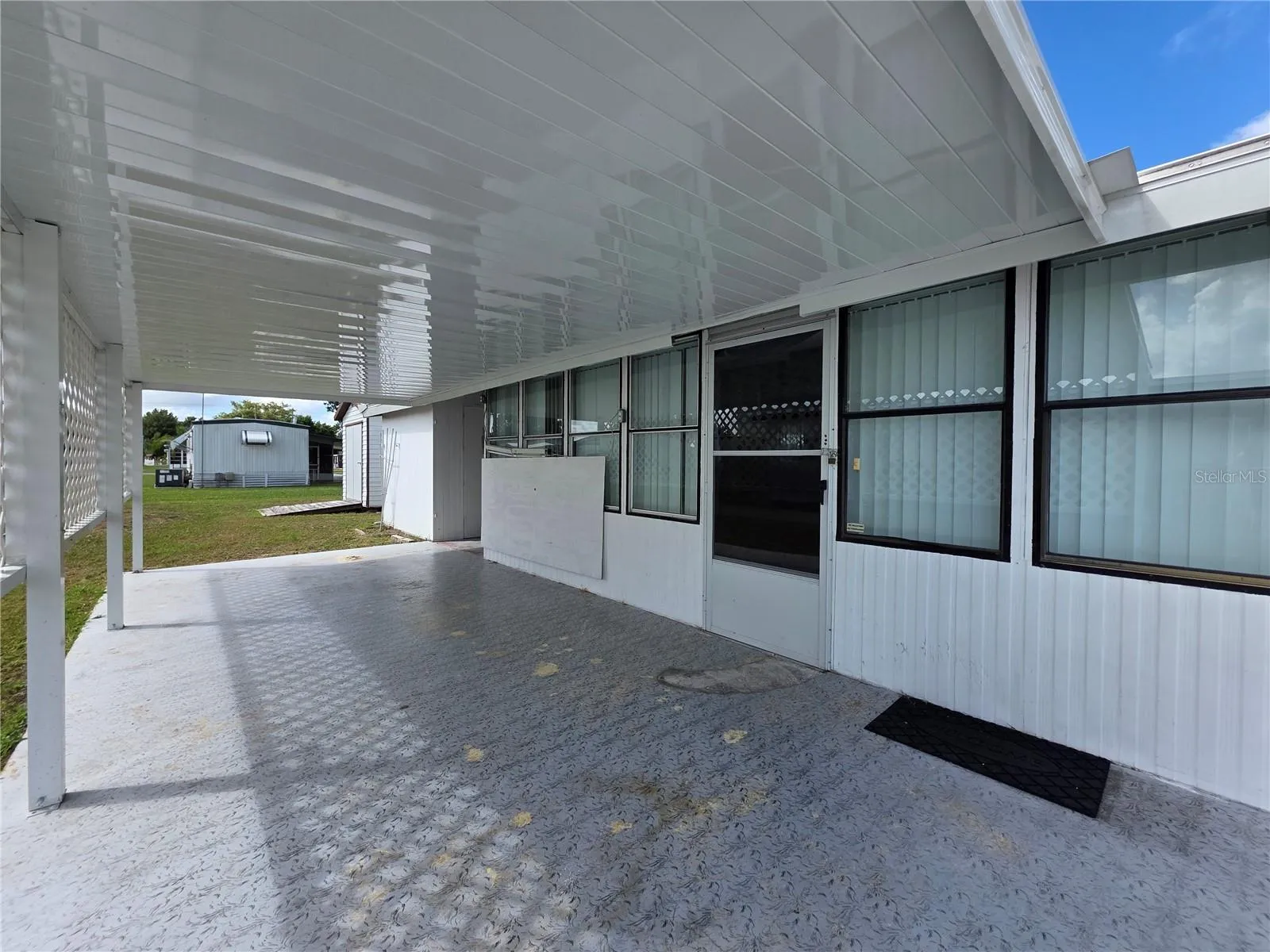 Driveway, carport &amp; Florida room entry.