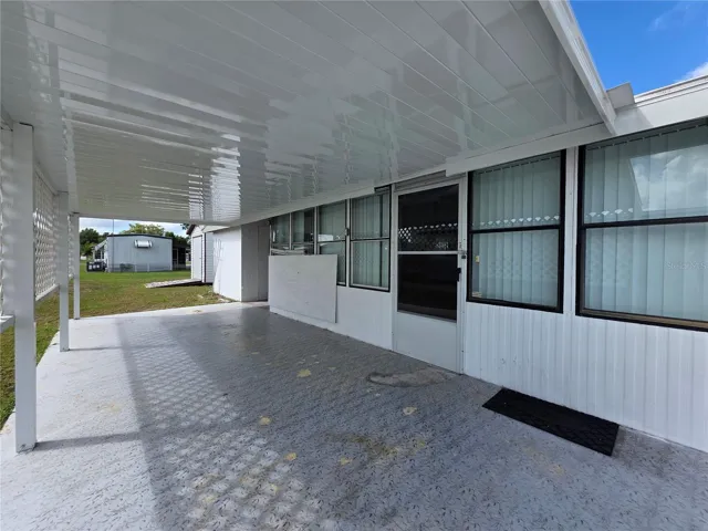 Driveway, carport &amp; Florida room entry.
