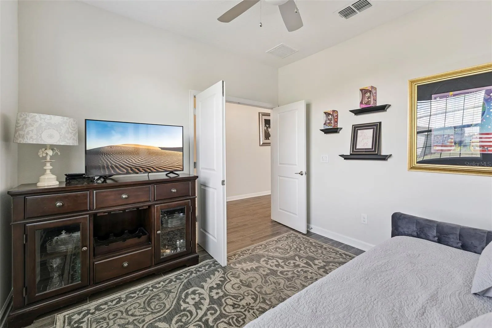 Den features French Doors and Ceiling Fan