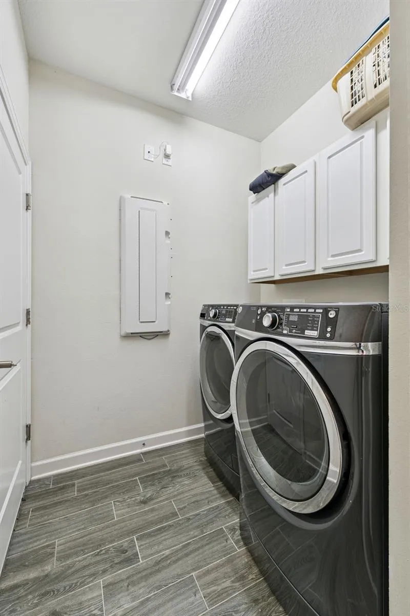 Laundry Room with cabinetry, washer and dryer