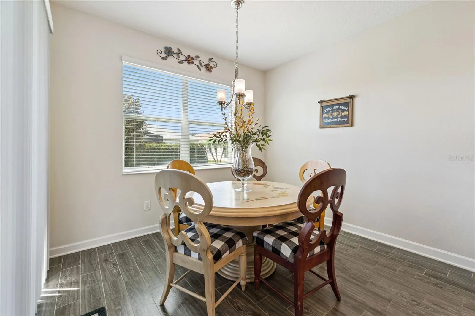 The charming breakfast nook offers the perfect spot for casual dining