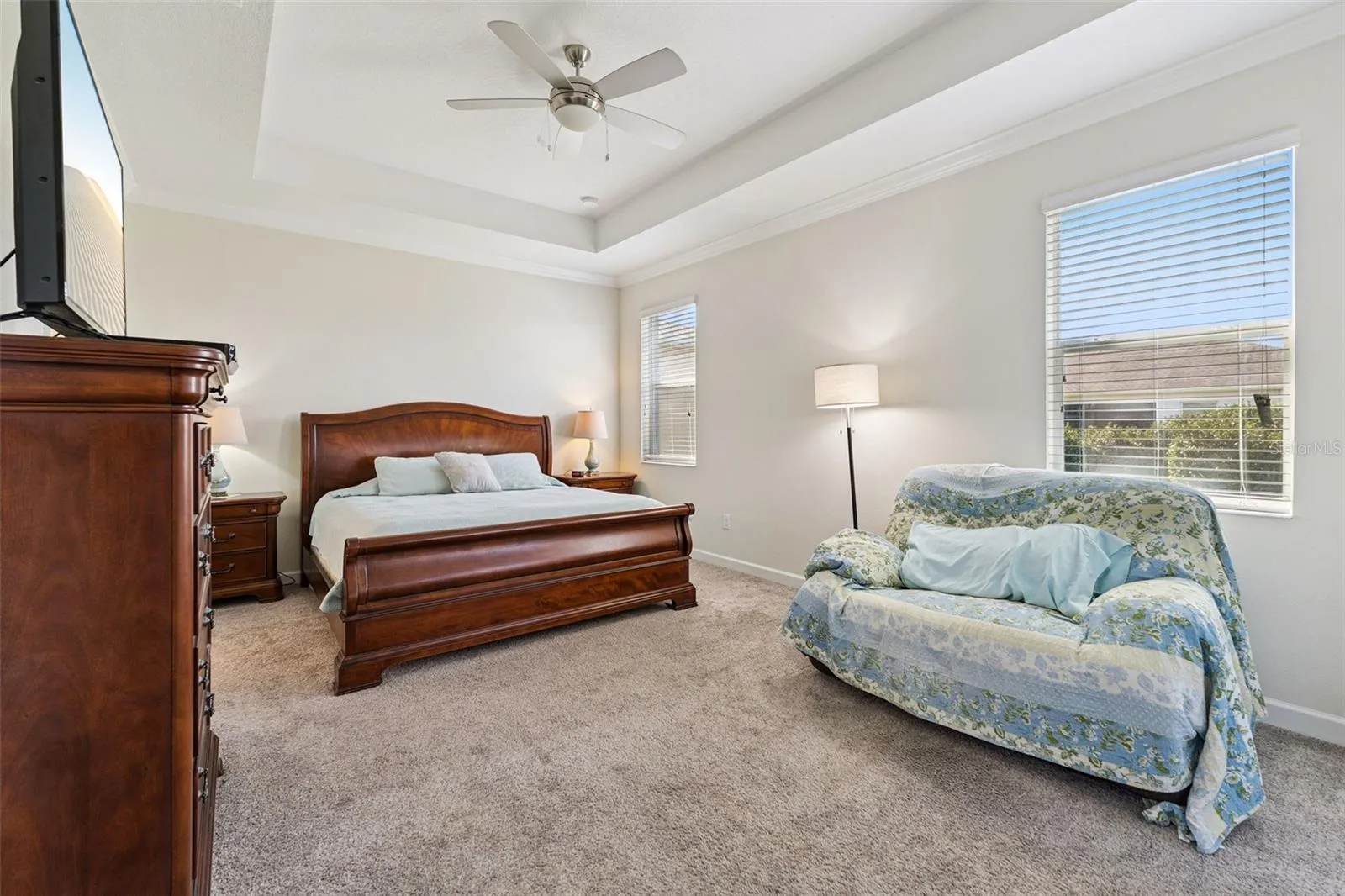The Primary Bedroom Suite offers a peaceful retreat, featuring a tray ceiling