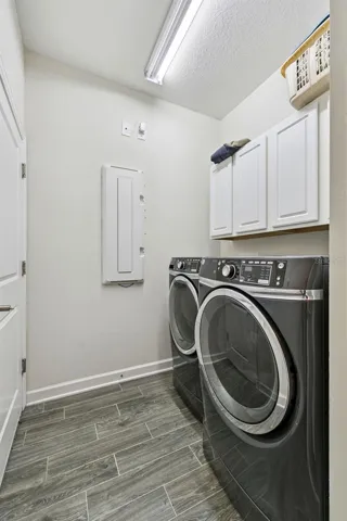 Laundry Room with cabinetry, washer and dryer