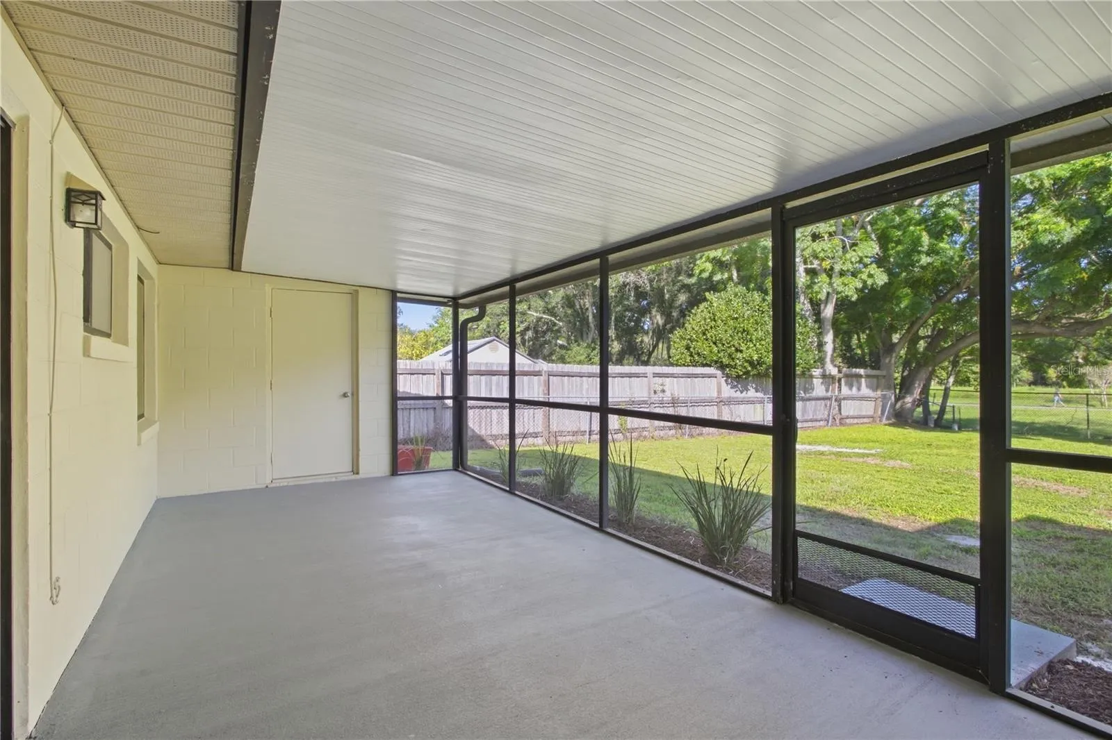 Spacious back porch includes utility closet with hookup for washer and dryer.