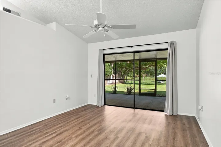 Living room area of Great Room/screened-in porch/fenced-in backyard