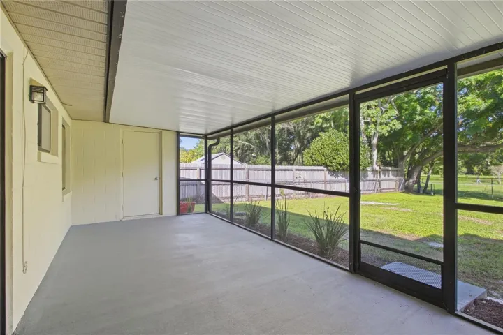 Spacious back porch includes utility closet with hookup for washer and dryer.