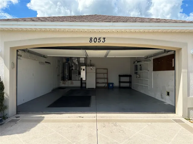 Clean spacious garage with EXTRA refrigerator