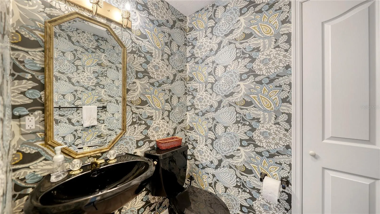 Guest half bath adjacent to Den