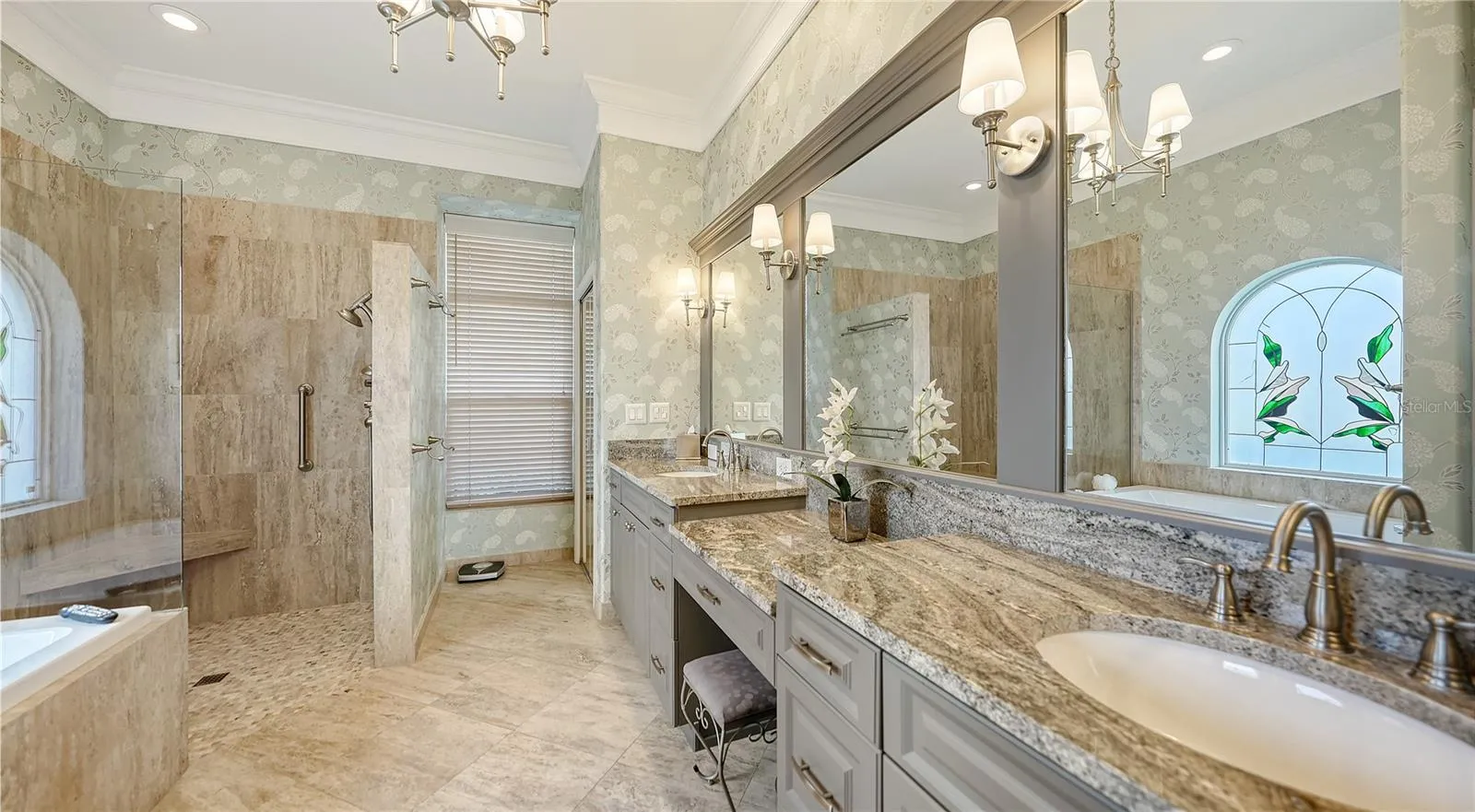 Primary bath with dual vanities , separate shower, and jacuzzi tub