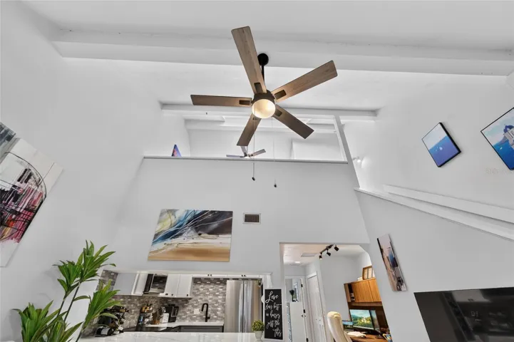 WOW! Soaring ceilings, modern lighting, and an open, airy design. This is no ordinary condo!