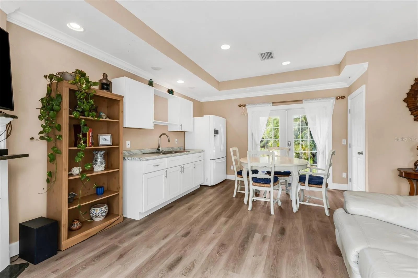 View of Kitchen, Living and Front entry. Large walk-in closet for added storage
