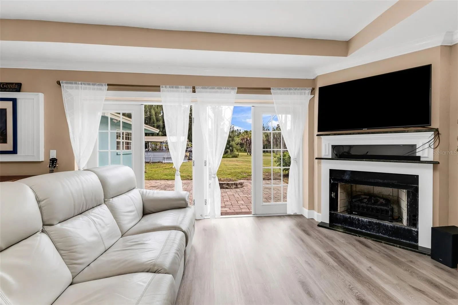 Living room with fireplace and French doors