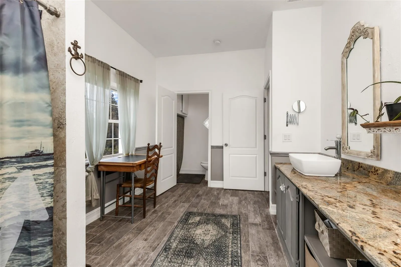 Upstairs bathroom with separate commode.