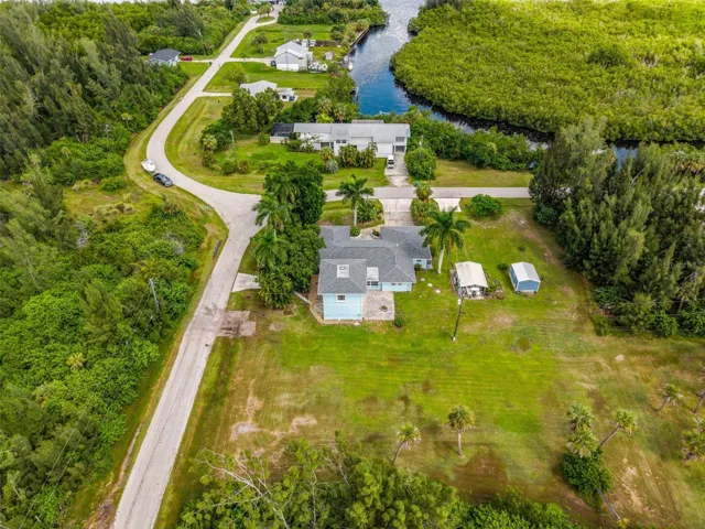 Aerial view of home and Peace River across the street