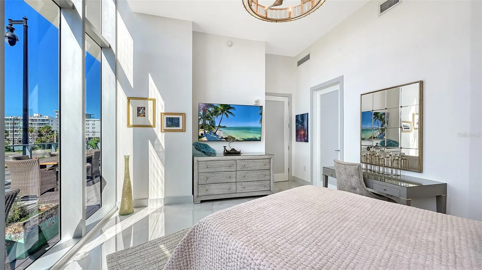 Unwind in the comfort of your luxurious primary suite while enjoying your favorite shows.