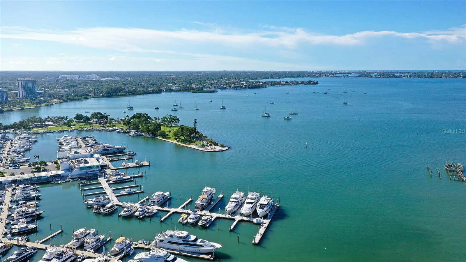 Enjoy breathtaking views of Sarasota Bay and the picturesque marina from this exceptional waterfront setting.