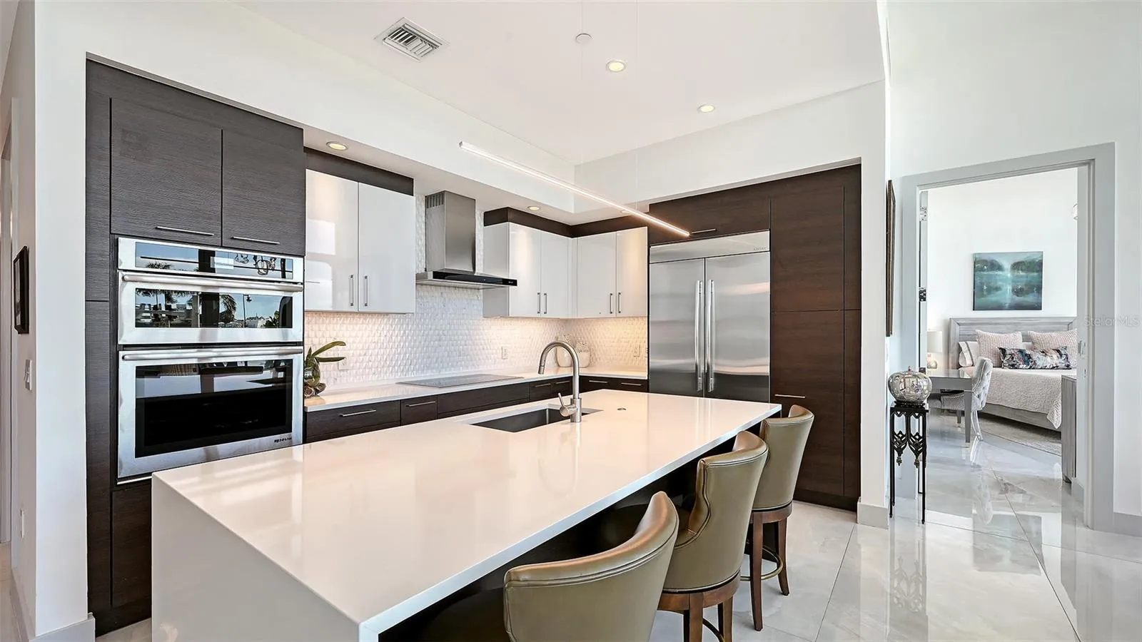 A beautifully appointed kitchen featuring top-of-the-line appliances, perfect for the culinary enthusiast and sophisticated entertaining