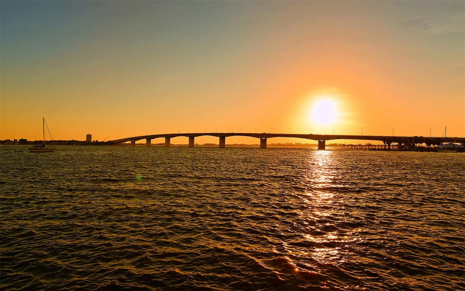 Savor breathtaking Sarasota sunsets as the sky transforms into a stunning canvas of vibrant colors over the bay.