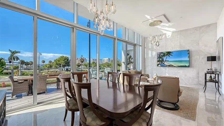 Ideal for entertaining, the spacious kitchen, dining, and living areas flow seamlessly together in an elegant, open-concept design.