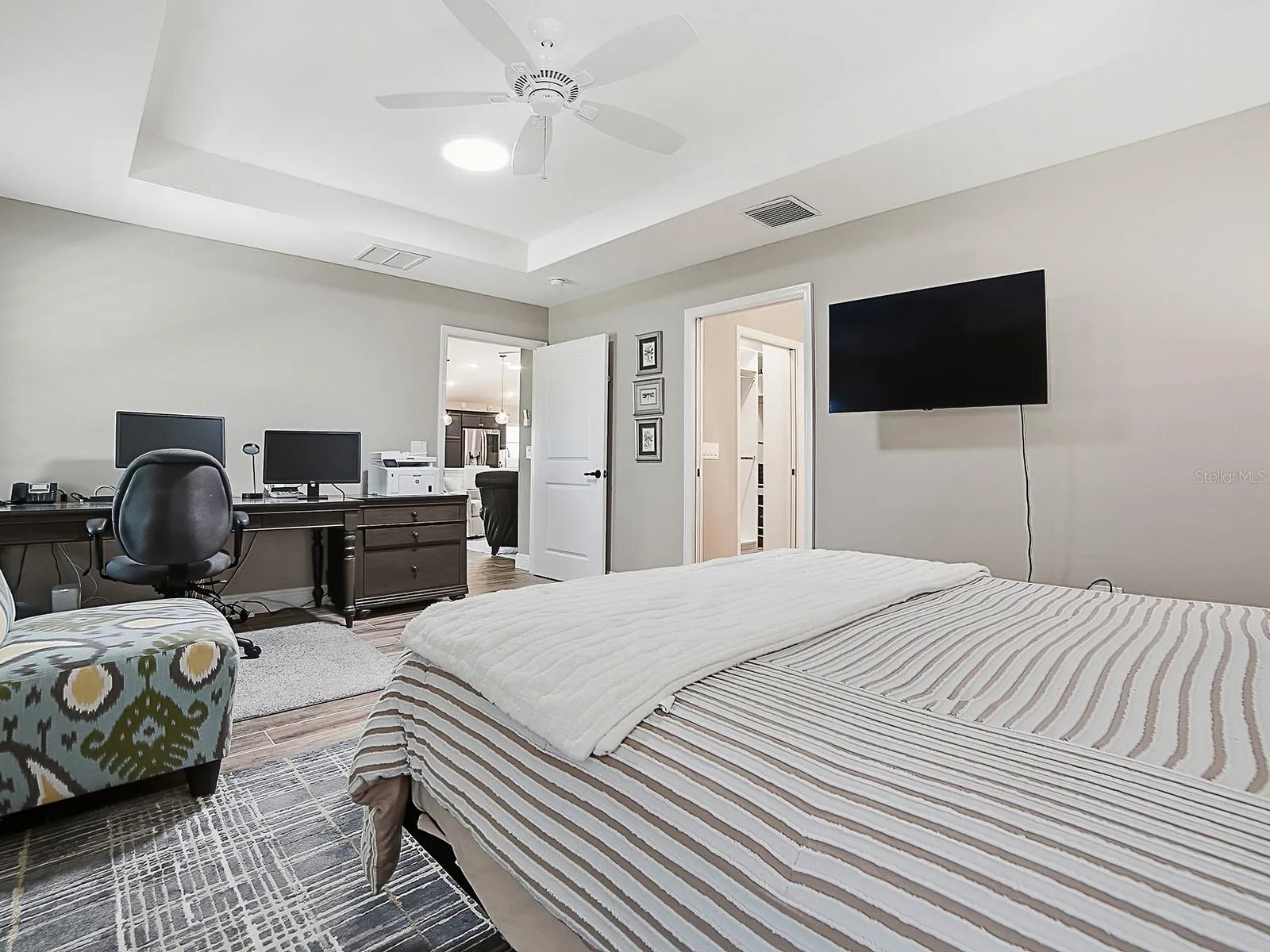 THIS DOOR LEADS TO THE EN-SUITE BATHROOM AND LARGE WALK-IN CLOSET.