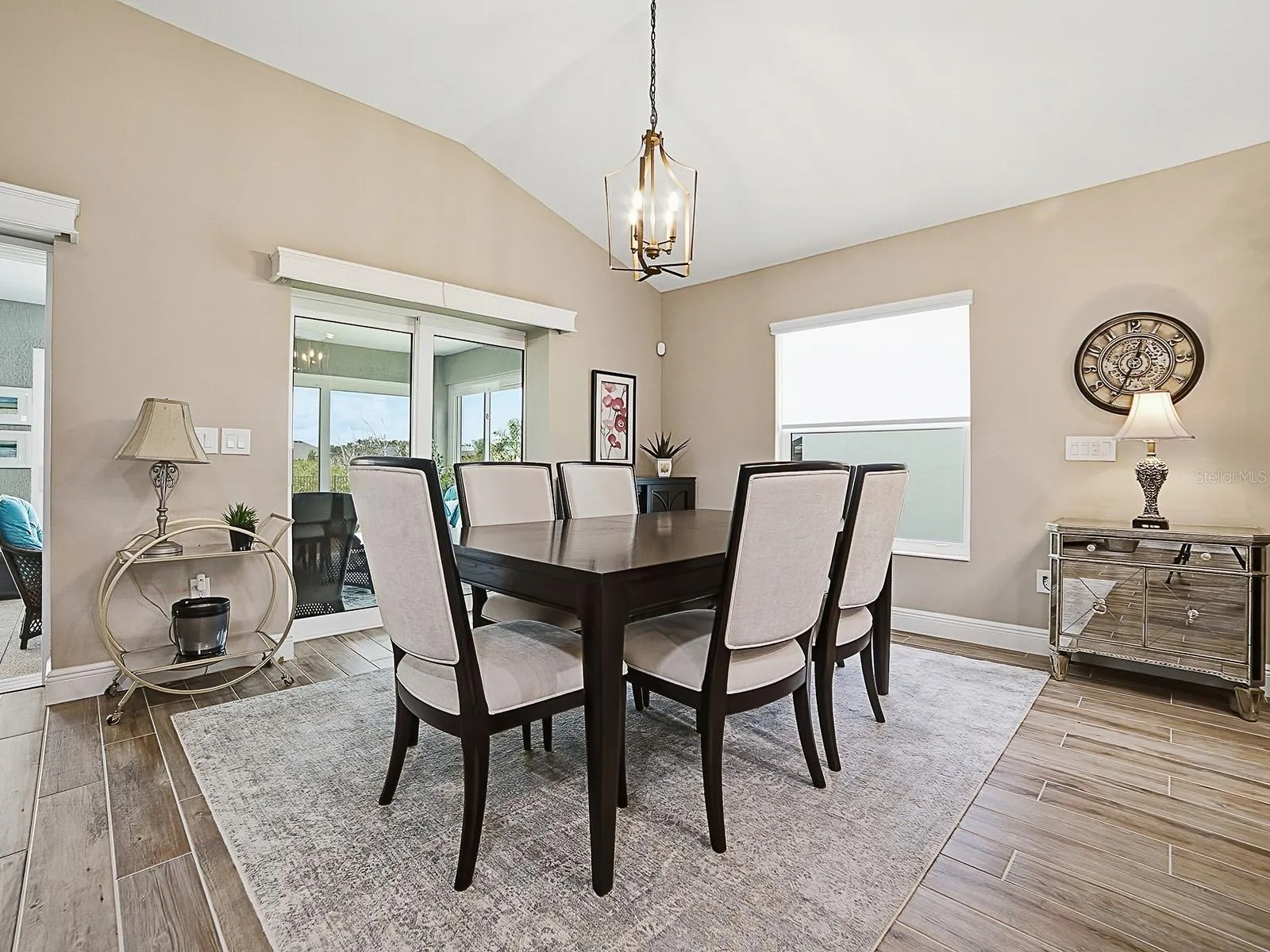 LIGHT AND BRIGHT WITH THE LARGE WINDOW AND STACKBACK SLIDING GLASS DOORS THAT OPEN TO THE FLORIDA ROOM OFFERING A GREAT VIEW OF THE PRESERVE.