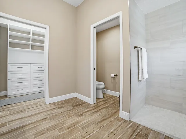 WALK-IN CLOSET TO THE LEFT WITH POCKET DOOR AND BUILT-INS.