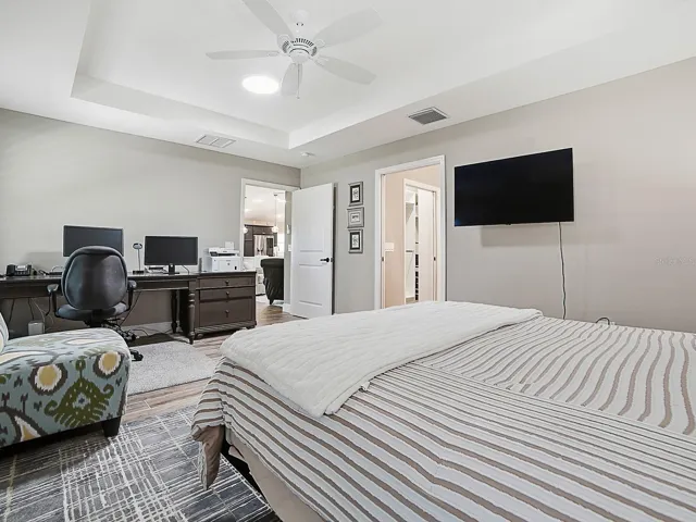 THIS DOOR LEADS TO THE EN-SUITE BATHROOM AND LARGE WALK-IN CLOSET.