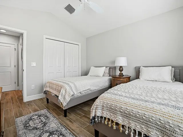 THIS GUEST SUITE IS TO THE RIGHT OF THE FOYER WHEN YOU ENTER THE HOME.  VAULTED CEILINGS AND DOUBLE DOOR CLOSET. LINEN CLOSET IN THE HALLWAY AND TO THE RIGHT IS THE GUEST BATH.