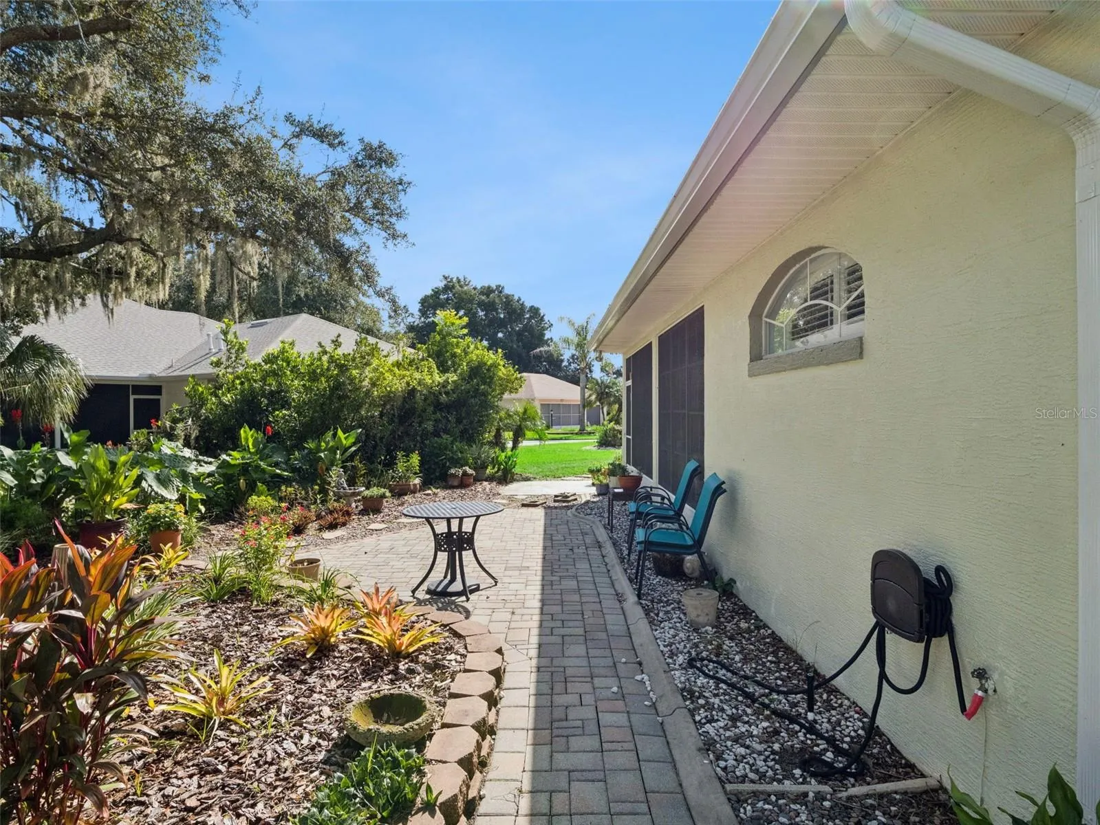 The rear patio has space to grill and nature watch.