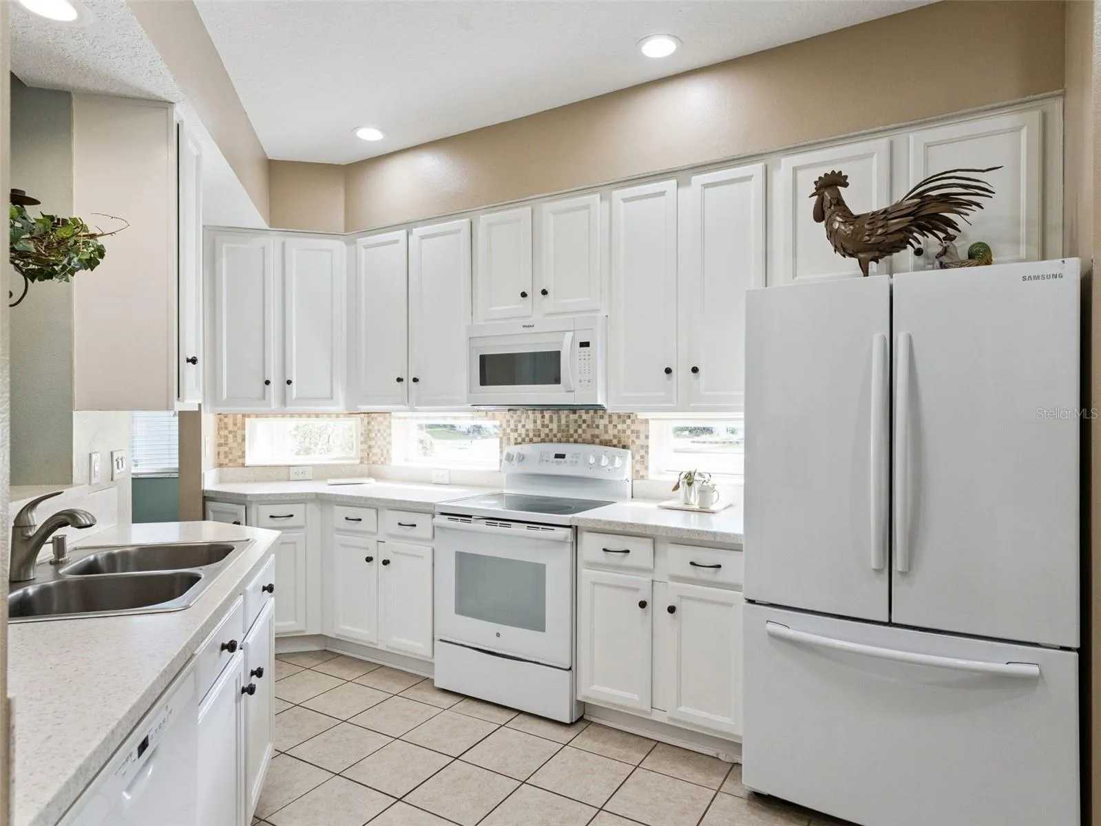 The Kitchen has ample 42" cabinets with pullouts on the bottom and stone counters.