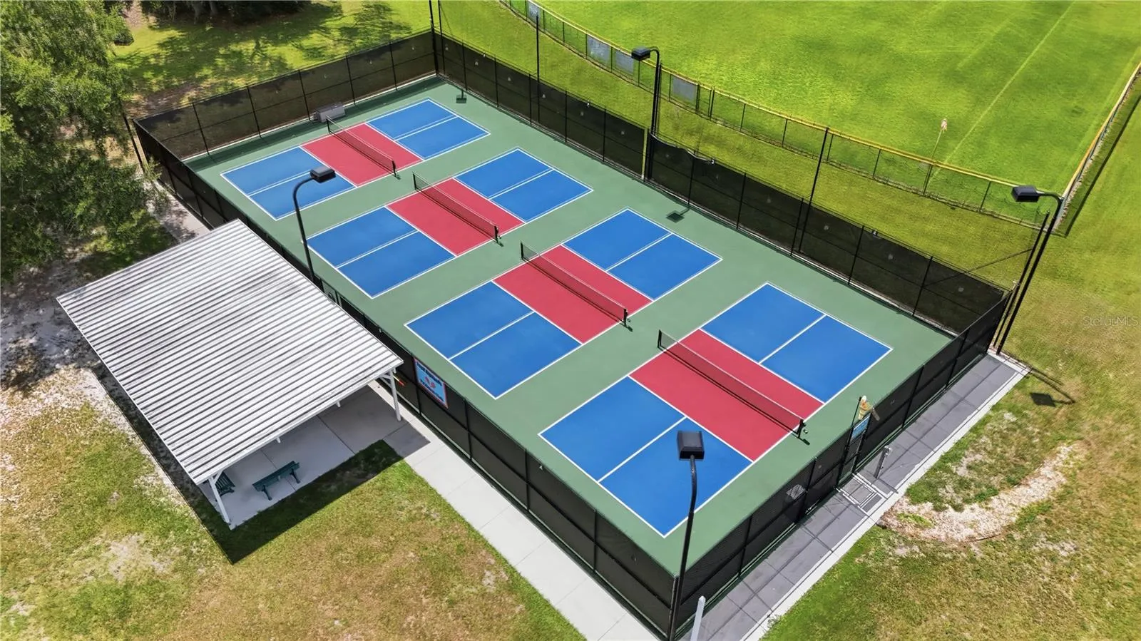 The PICKLEBALL COURTS, where residents enjoy mixed-team play.