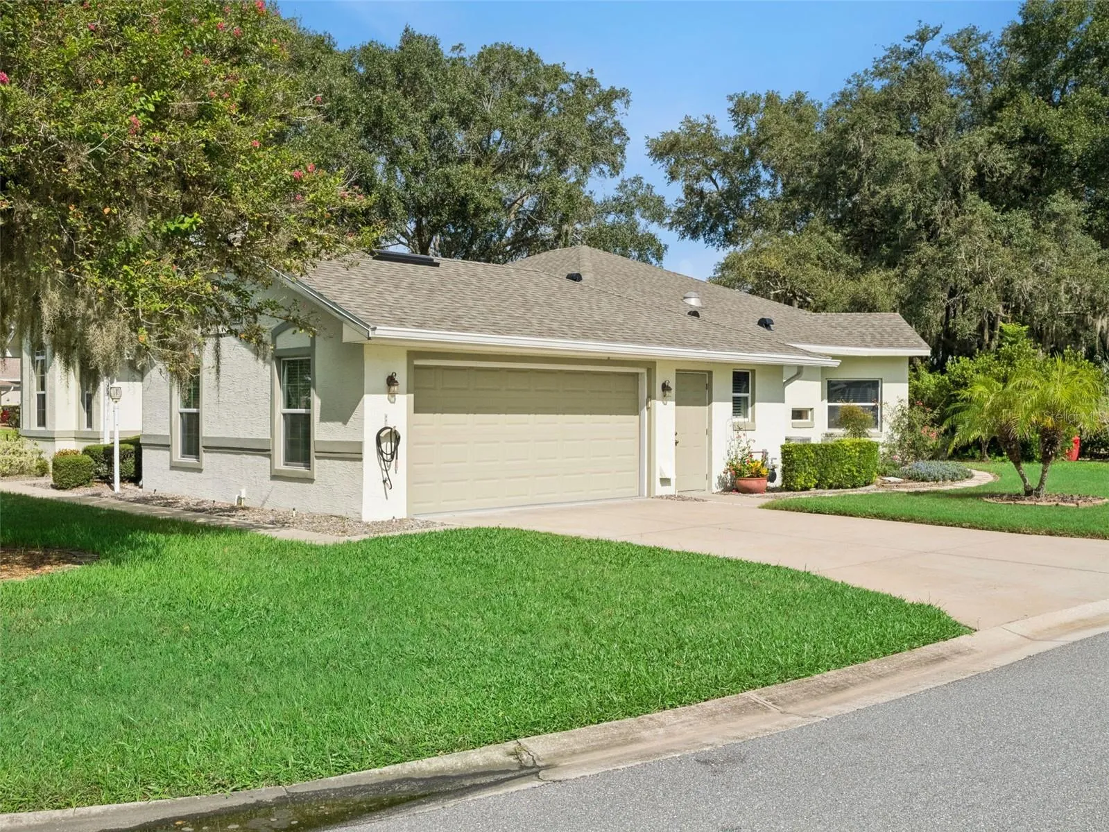 The OVESIZED SIDE GARAGE adds curb appeal to the hom.and has lots of room for a workbench & storage.