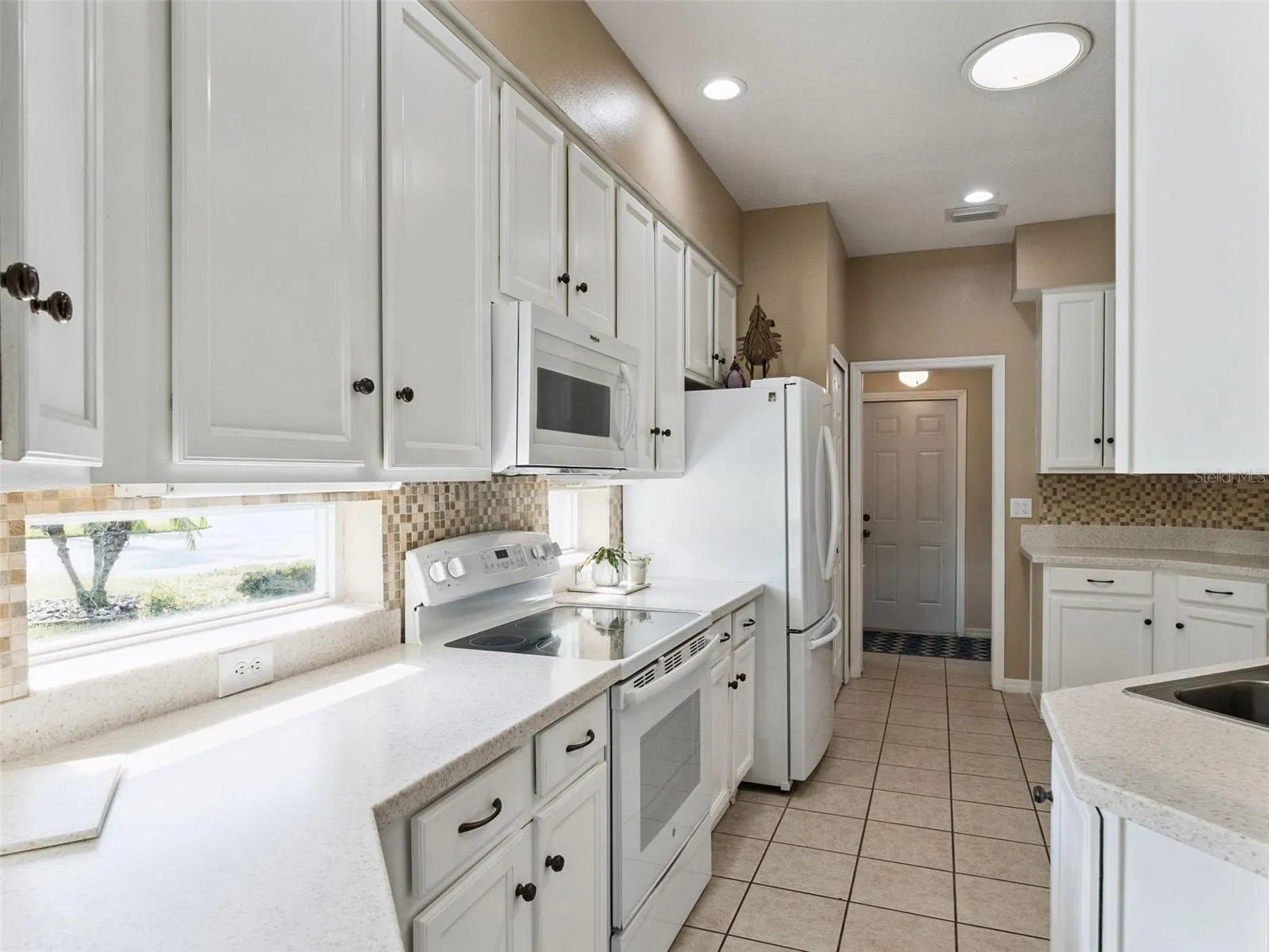 The recipe windows and solar tube provide lots of natural light to the kitchen.