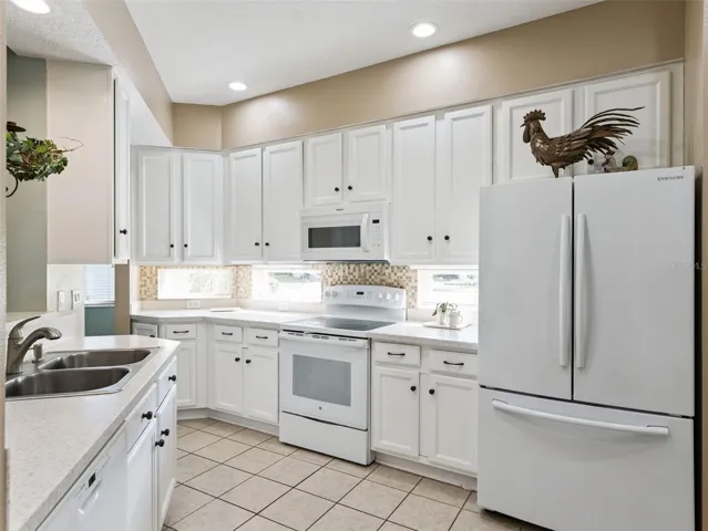 The Kitchen has ample 42" cabinets with pullouts on the bottom and stone counters.