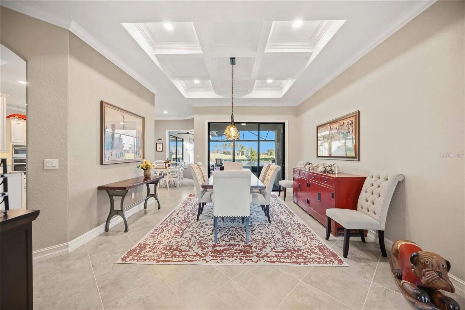 The dining room, grid ceilings, custom millwork throughout the home.