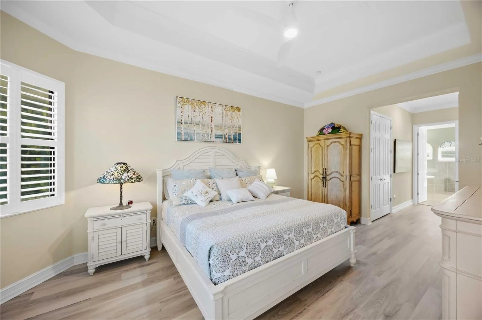 Primary Bedroom with entry to the lanai overlookiing the pool/spa